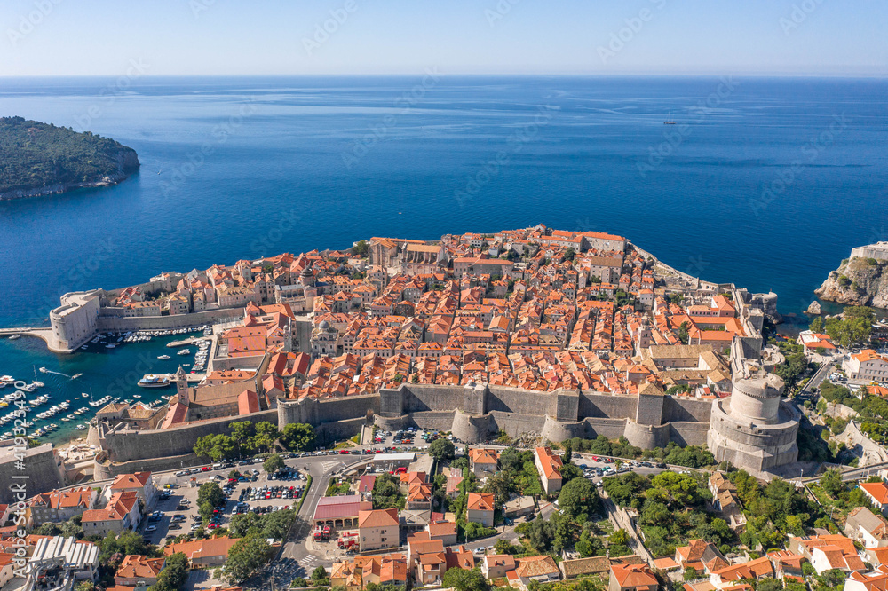 Aerial drone shot of Dubrovink city old town with view of Lokrum island in Croatia summer morning