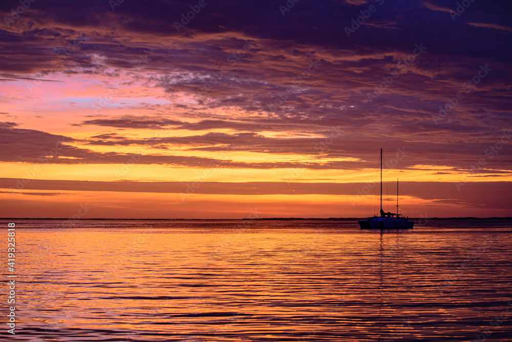 Yacht boat on the sea. Sailboats at sunset. Ocean yacht sailing. Yacht boat on the sea. Sailboats at sunset. Ocean yacht sailing.