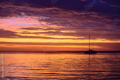 Yacht boat on the sea. Sailboats at sunset. Ocean yacht sailing.