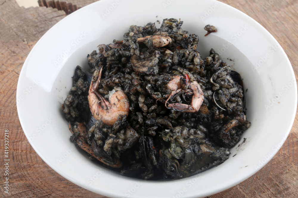seafood black rice with aquid ink as typical spanish dish seafood black rice with aquid ink as typical spanish dish