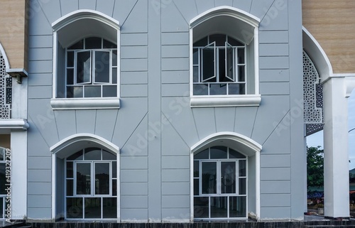 Minimalist house window. Modern style glass windows. Big windows vintage model.  © Habib