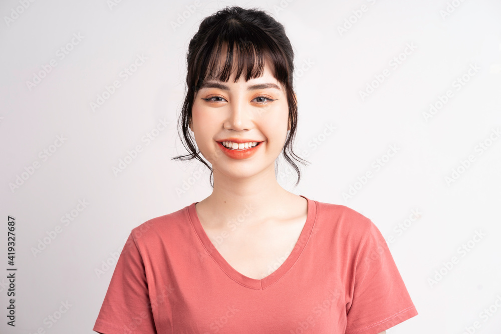 Young Asian woman posing on white background Young Asian woman posing on white background
