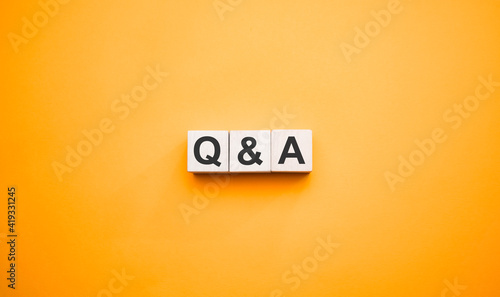 Q and A, questions and answers on wooden cubes. Concept photo