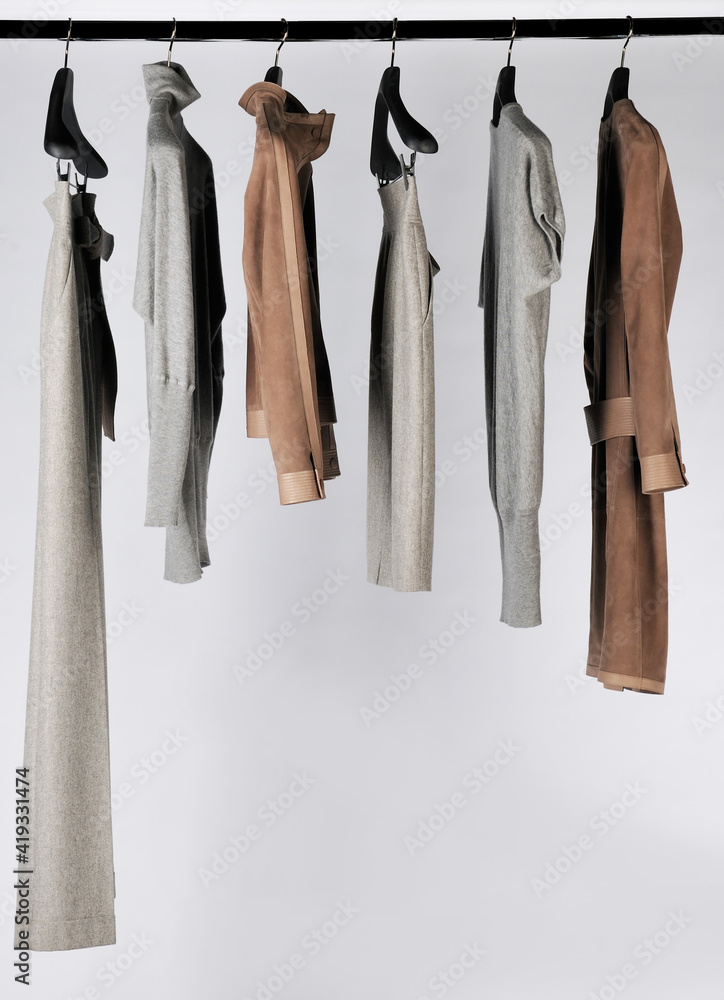 Elegant and trendy women's clothes hanging Elegant and trendy women's clothes hanging
