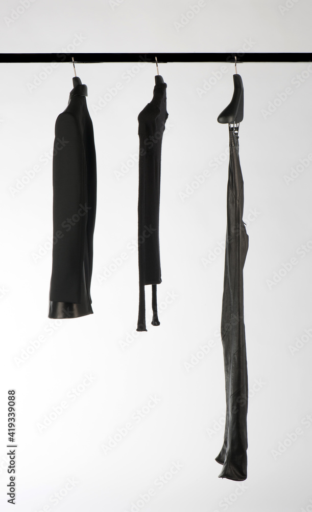 Elegant and trendy clothes for women hanging. Elegant and trendy clothes for women hanging.