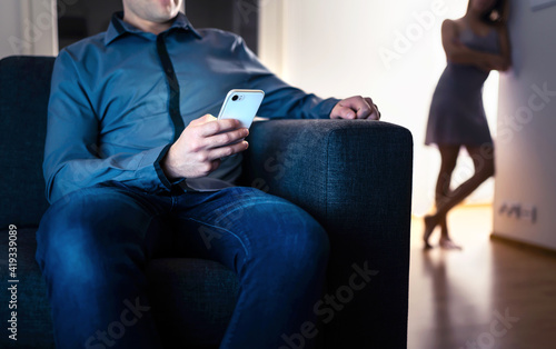 Fototapeta Jealous woman and cheating man with a phone