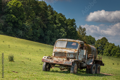 old rusty truck in the field photo