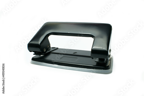 Office paper perforator on white background