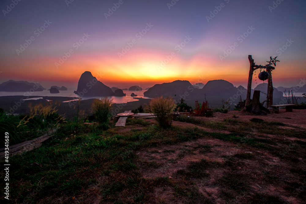 Panoramic nature background (mountains, sea, trees, twilight lights in the sky, waterfront communities), naturally blurred through the wind, seen on tourist spots or scenic spots