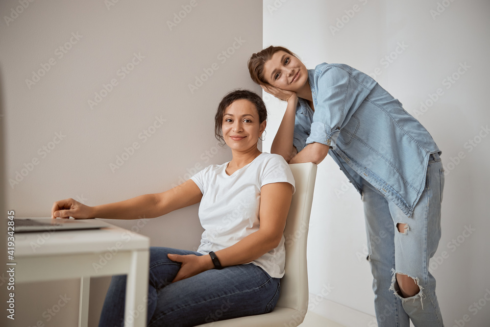 Two pretty females looking straight at camera Two pretty females looking straight at camera