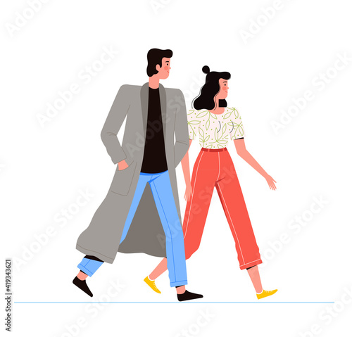 Young man and woman walking together on the street. People in fashionable clothes are walking. Isolated on white background