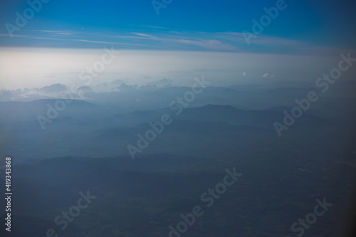 Blurred abstract background from high angle from plane window  overlooking the scenery below  river  mountain  tree .