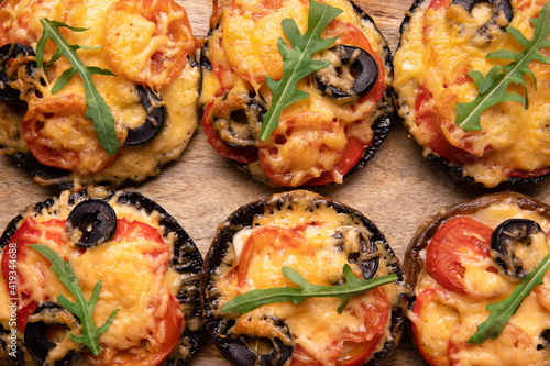 pizza portobello mushrooms on wooden background, proper nutrition concept photo