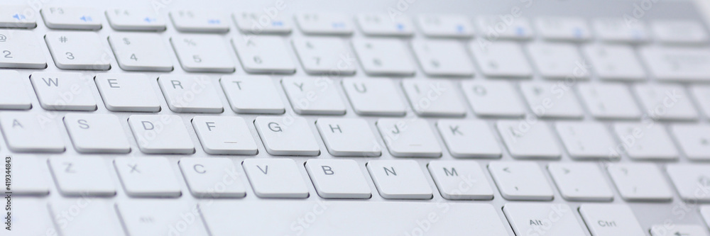 Close-up modern computer keyboard lies on document. User work tool with laptop. Care and maintenance. Equipment repair during quarantine. Connection problems. Order laptop keyboard in an online store Close-up modern computer keyboard lies on document. User work tool with laptop. Care and maintenance. Equipment repair during quarantine. Connection problems. Order laptop keyboard in an online store