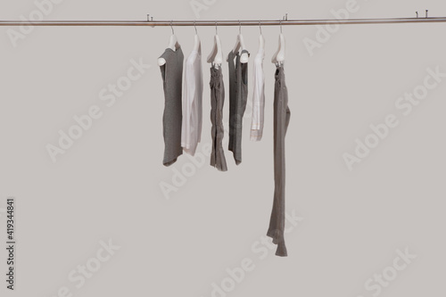 Elegant and trendy clothes for women hanging. © AidaTiara