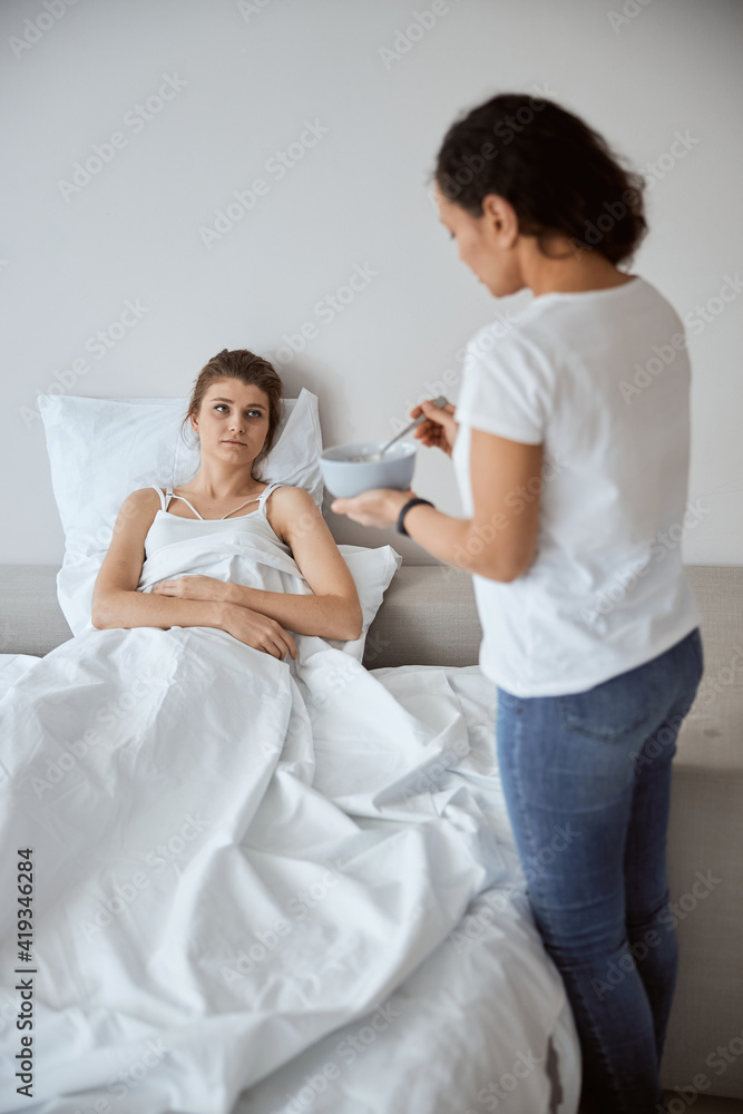 Upset young female feeling bad in the morning Upset young female feeling bad in the morning