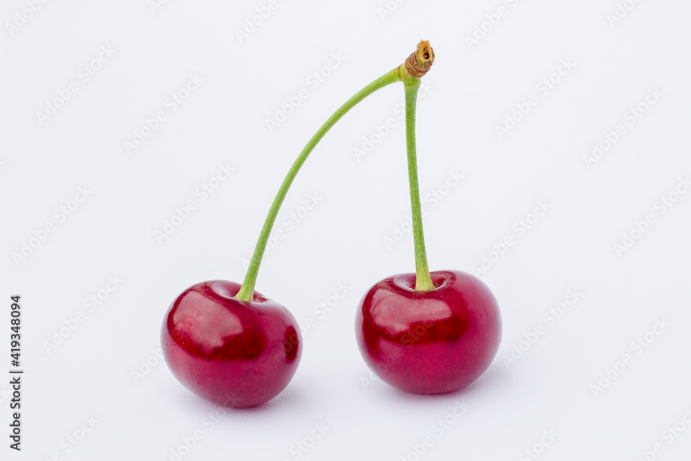 two cherries on a white background,
ripe cherry two cherries on a white background,
ripe cherry