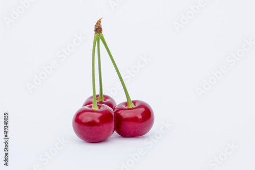 cherries on white background,
ripe cherry