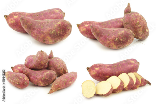 Freshly harvested sweet potato and some slices on a white background
