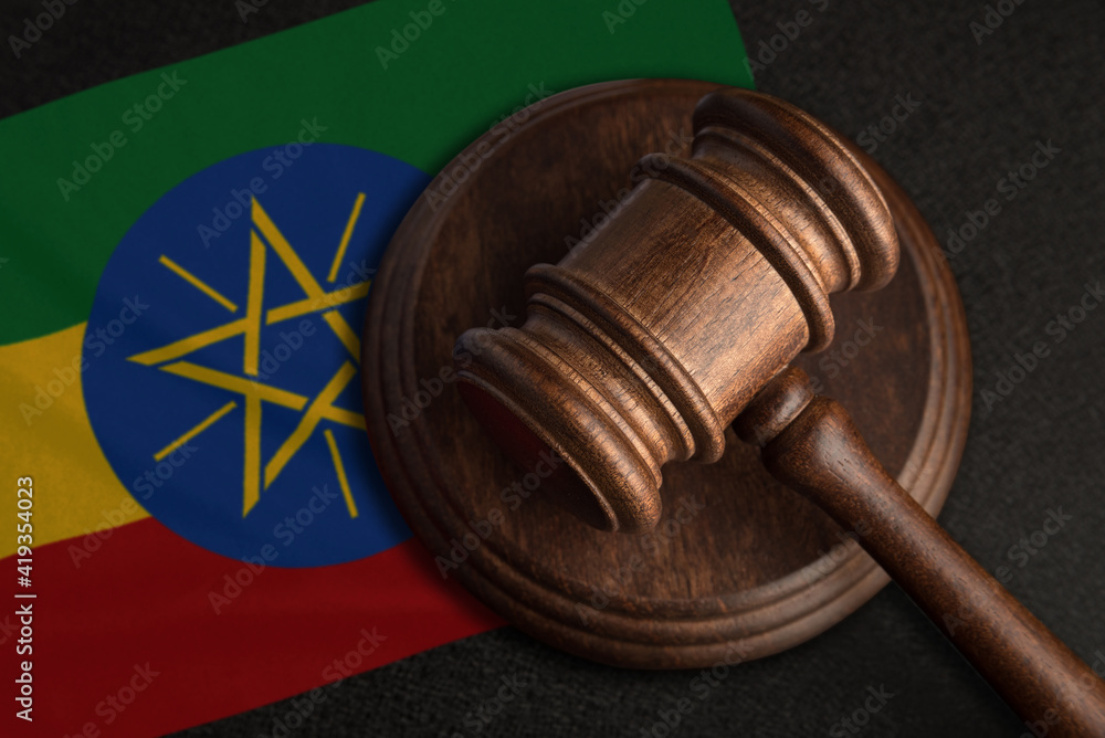 Judge gavel and flag of Ethiopia. Law and justice in Ethiopia. Violation of rights and freedoms