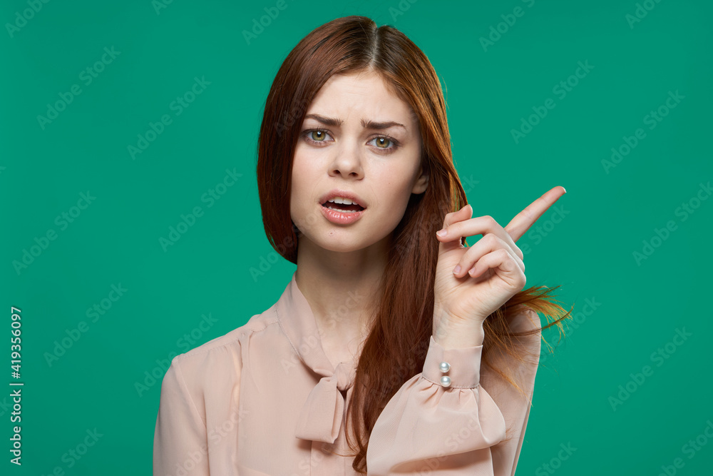 beautiful woman showing finger to side emotion charm cropped view