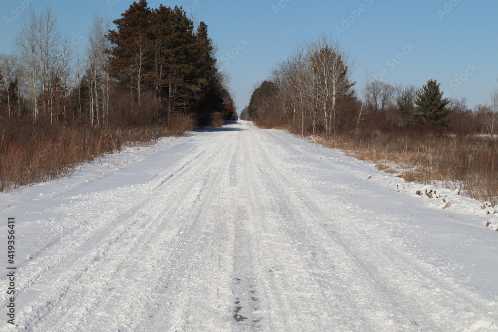 snow covered road in winter vanishing point snow covered road in winter vanishing point