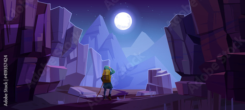 Hiker man on road in mountains at night. Vector cartoon landscape of nature park with canyon, stone cliffs, rocks, moon in sky and tourist with backpack for hiking on path