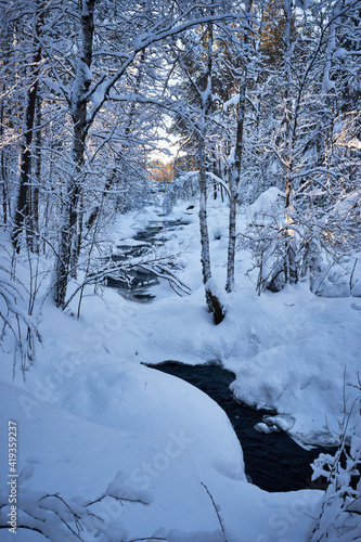 Snowy creek in lapland