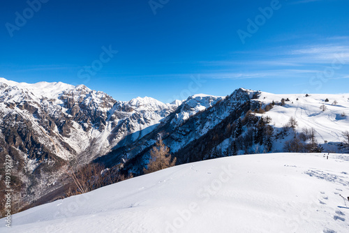 Mountain range of the Monte Carega in winter with snow, also called the Small Dolomites (Piccole Dolomiti) and the Altopiano della Lessinia (Lessinia Plateau). Veneto and Trentino Alto Adige, Italy.