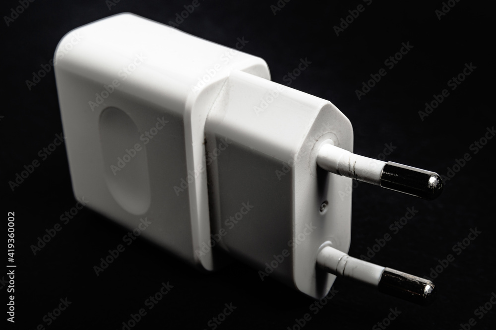damaged phone charger on a black background damaged phone charger on a black background