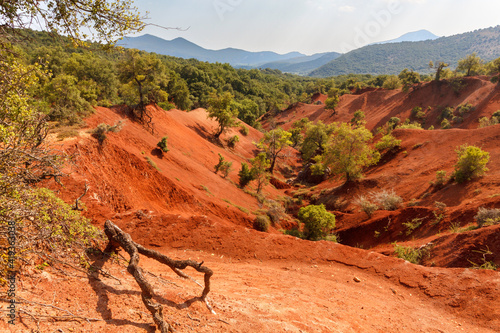 Red clay terrain, a rare geological phenomenon, as seen near Preveza city, in Epirus region, Greece, Europe. photo