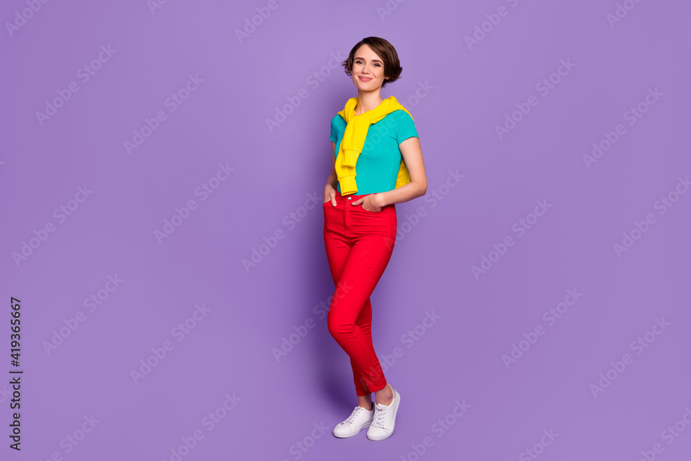 Full length photo of lady hands pockets wear tied sweater t-shirt pants footwear isolated violet color background