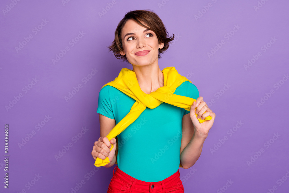 Photo of charming minded lady look empty space wear knotted pullover t-shirt isolated violet color background Photo of charming minded lady look empty space wear knotted pullover t-shirt isolated violet color background