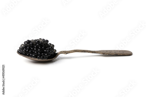 Spoon completely filled with black caviar