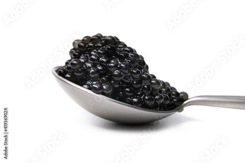 Spoon completely filled with black caviar