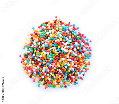 Colorful sprinkles on white background  top view. Confectionery decor