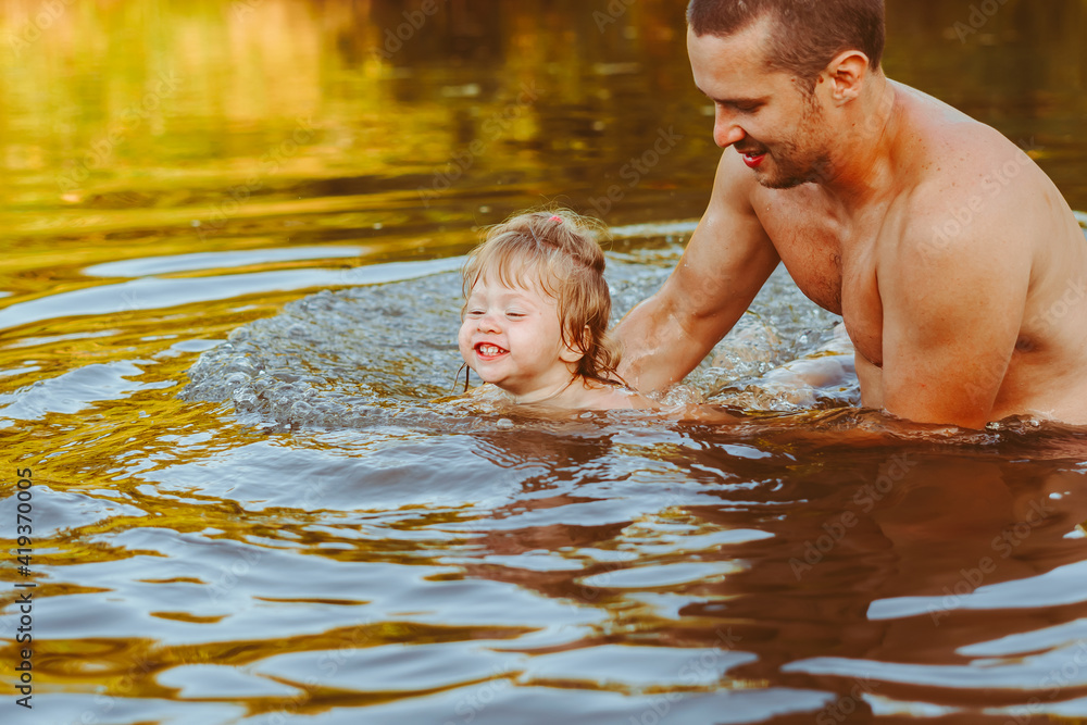 the father with the child in the water the father with the child in the water