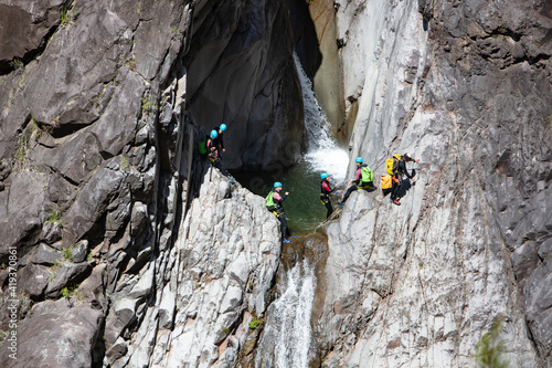 Rafting Team on a Cascade cliff photo