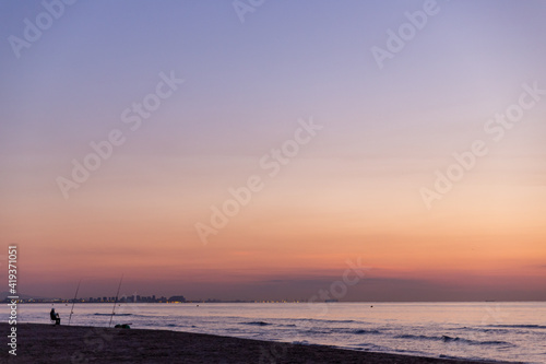 sunrise with beautiful colors at malvarosa beach of the City of valencia, costa blanca, spain
