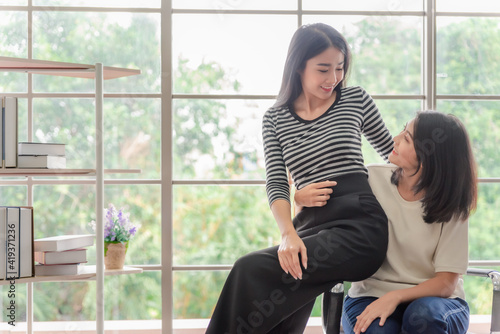 Young asian women lesbian lgbt couple with happy moment. LGBT lesbian couple together indoors concept.
