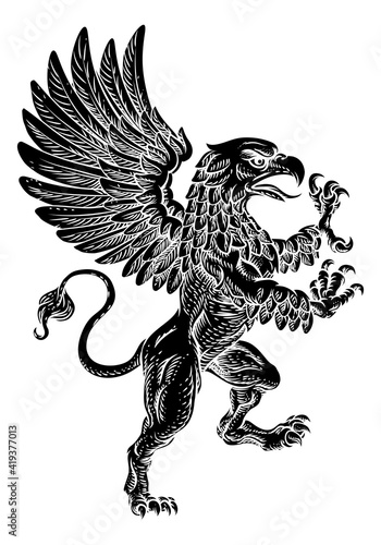 A griffin also known as a gryphon or griffon with lion body, wings and eagle head. Rampant standing on hind legs coat of arms crest mascot photo