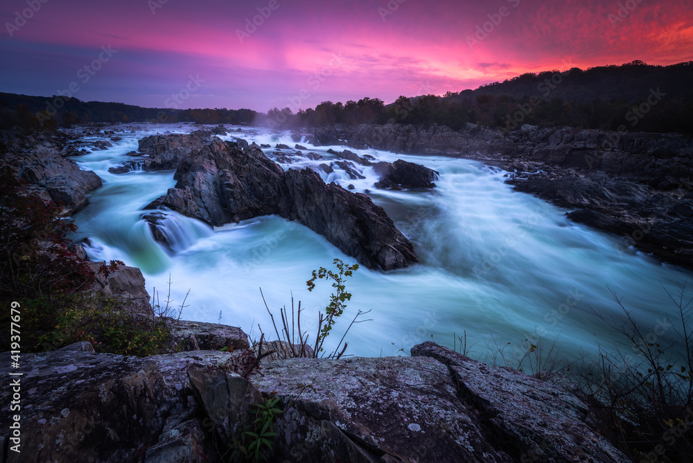 An approaching nor'easter up the east coast caused a very colorful pink and purple sunrise on this particular morning at Great Falls Park.