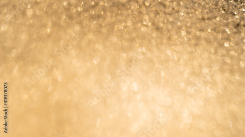 Beautiful abstract de-focused glitter vintage golden lights photo background © Andrii Oleksiienko
