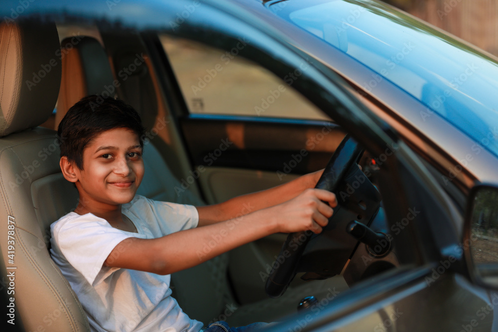 Cute Indian child in car