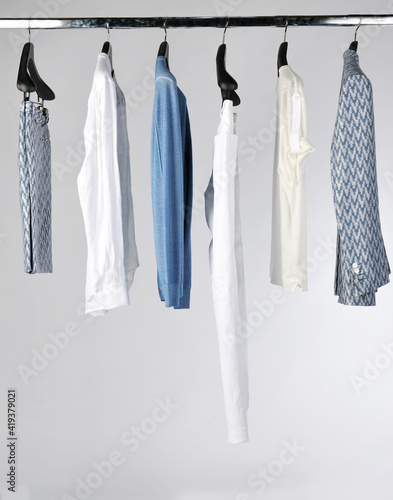 Elegant and trendy men's clothes hanging