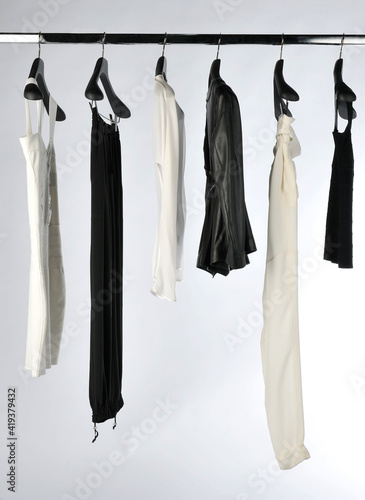 Elegant and trendy women's clothes hanging