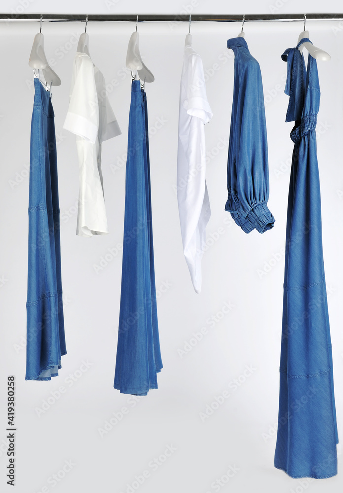 Elegant and trendy women's clothes hanging Elegant and trendy women's clothes hanging