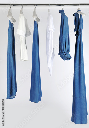 Elegant and trendy women's clothes hanging
