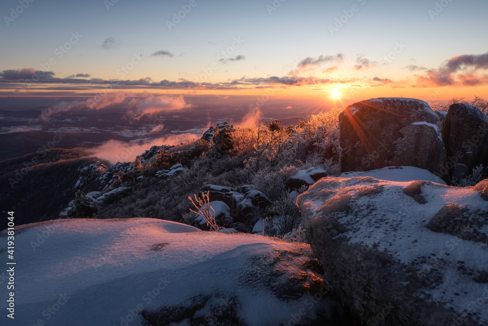 An arctic like sunrise at the summit of Old Rag Mountain in Shenandoah National Park the morning after a snow/ice storm went up the east coast.