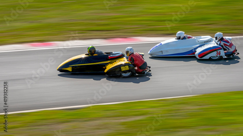 A panning shot of a racing sidecar as it corners on a track. © SnapstitchPhoto